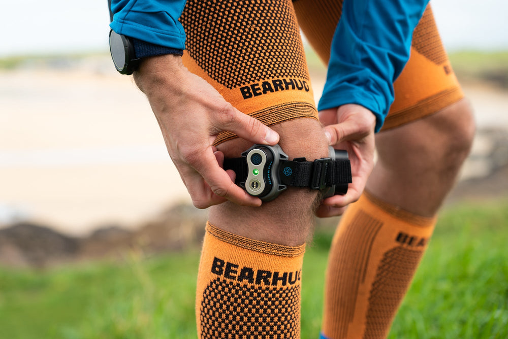 An image of a man's knee with light therapy tool which is effective for wound healing.